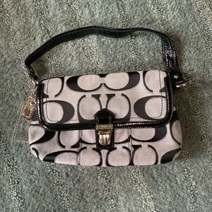 Coach Poppy Flap Push Closure bag.
